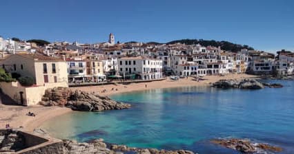Sandy cove and turquoise water on Costa Brava, coastal swimming spot