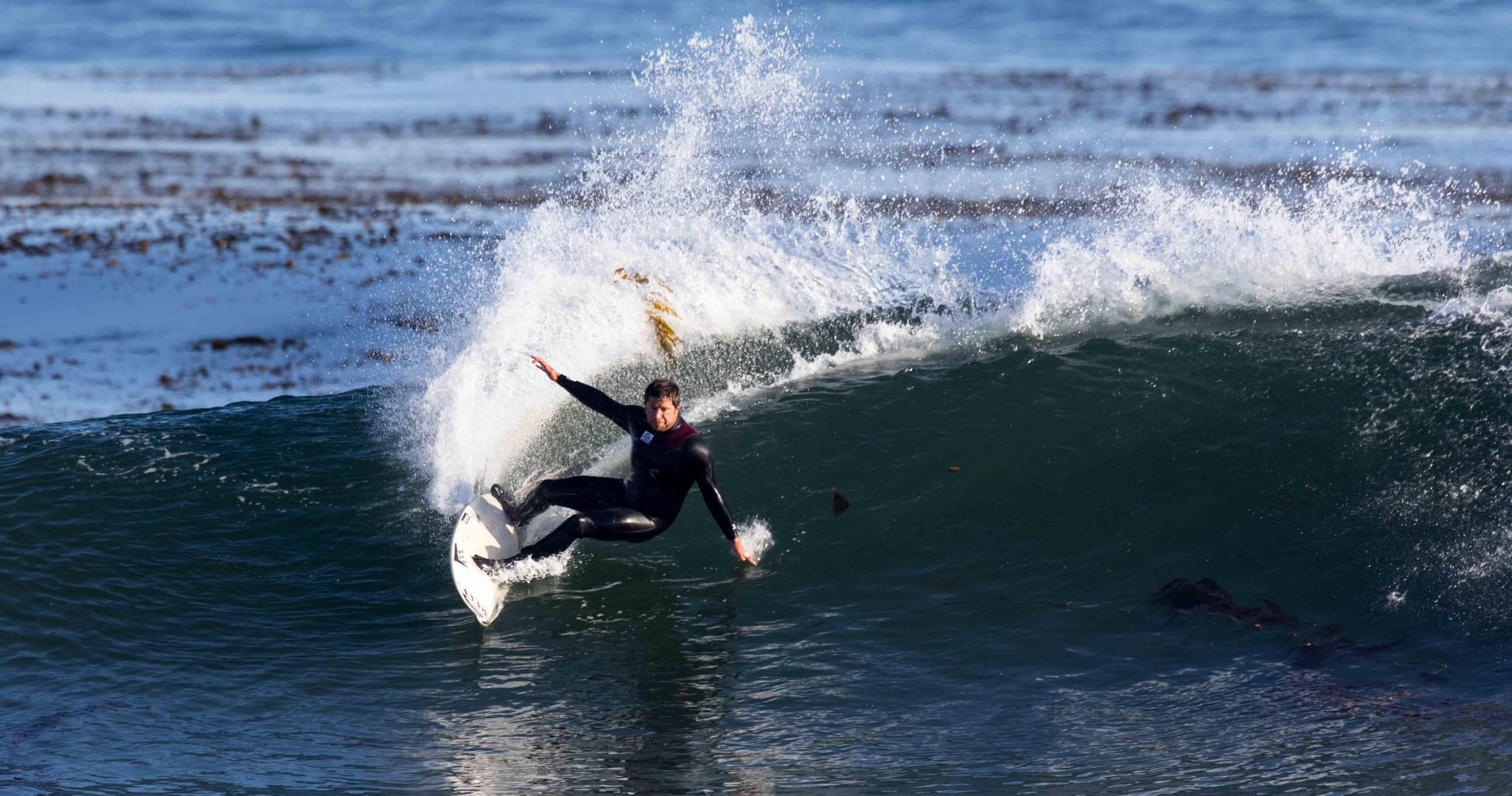 Surfer carving powerful wave near Santa Cruz shore