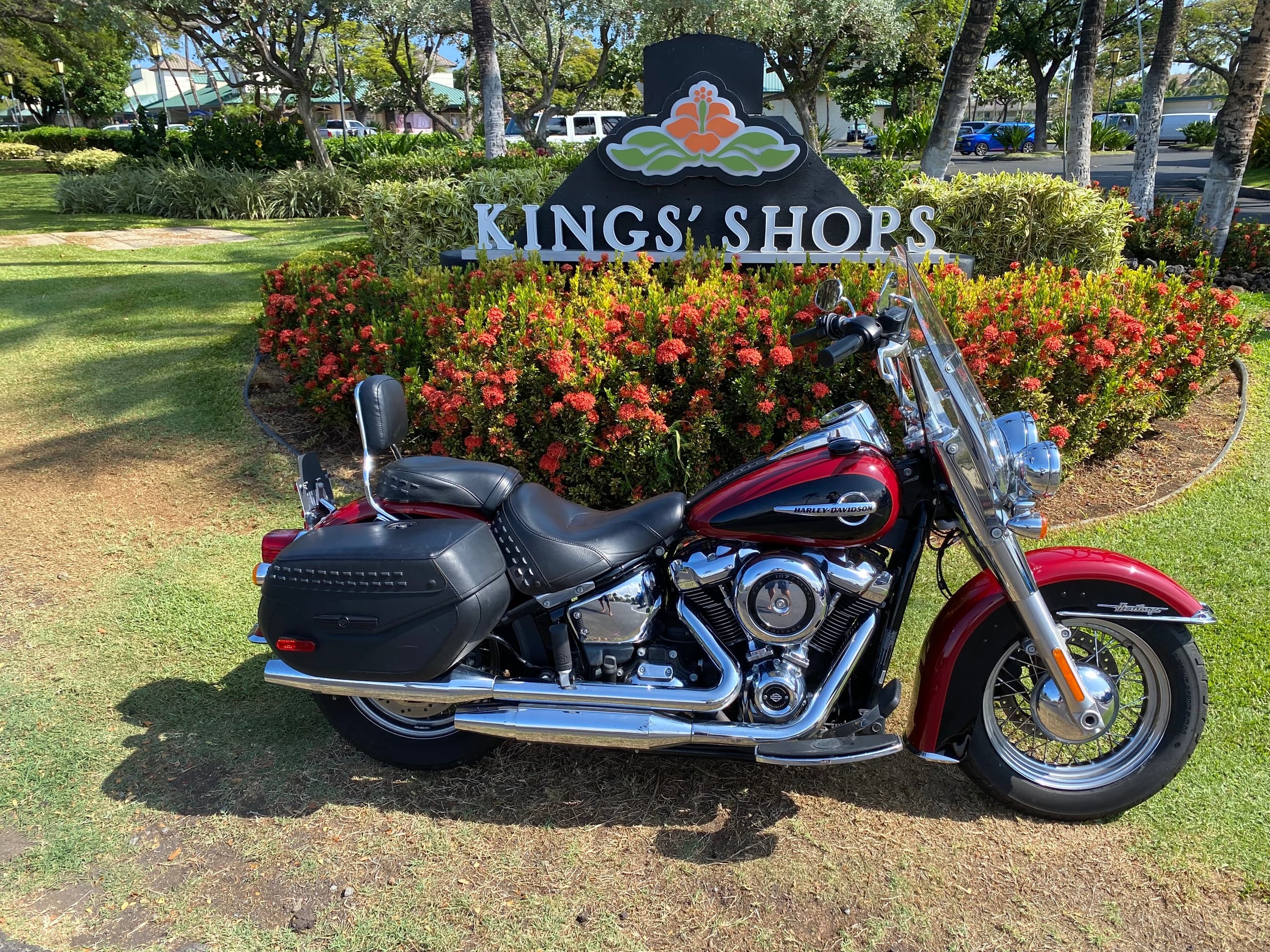 Red and black cruiser motorcycle near Kings' Shops garden Waikoloa