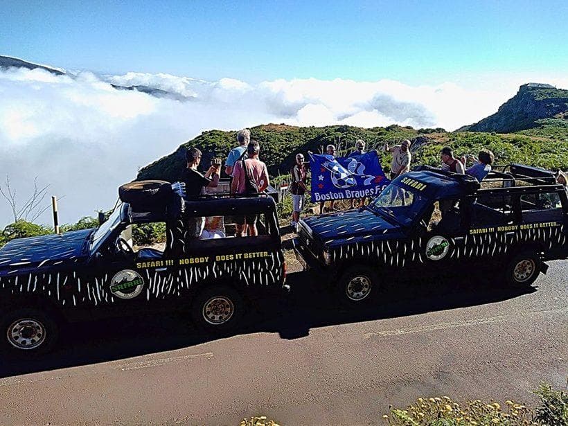 Open-top jeep safari above cloud inversion on Madeira cliffs