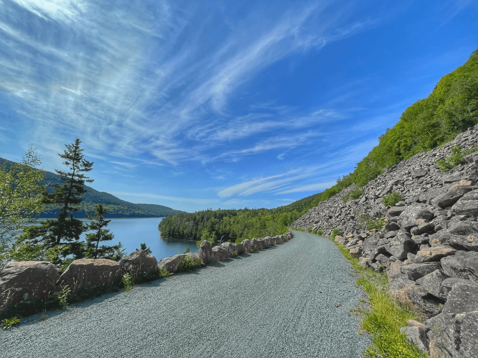 Scenic coastal carriage road and shoreline view for cycling
