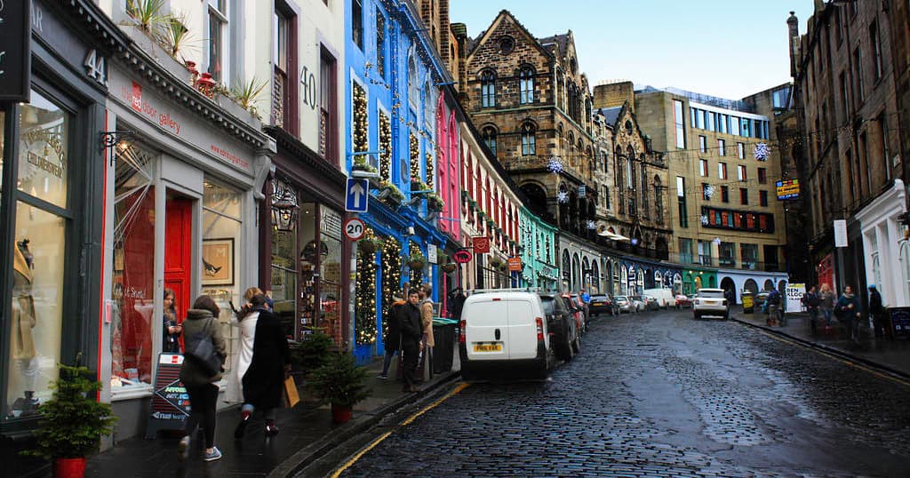 Cobblestone street walking tour through colorful historic neighborhood