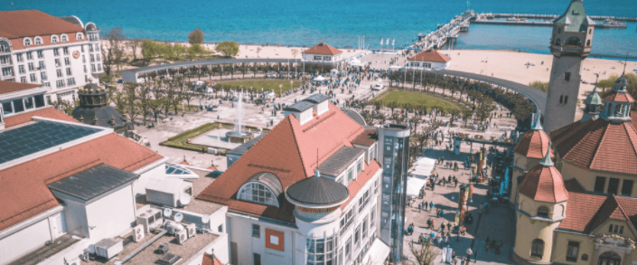 Aerial view of coastal city skyline and beachfront promenade