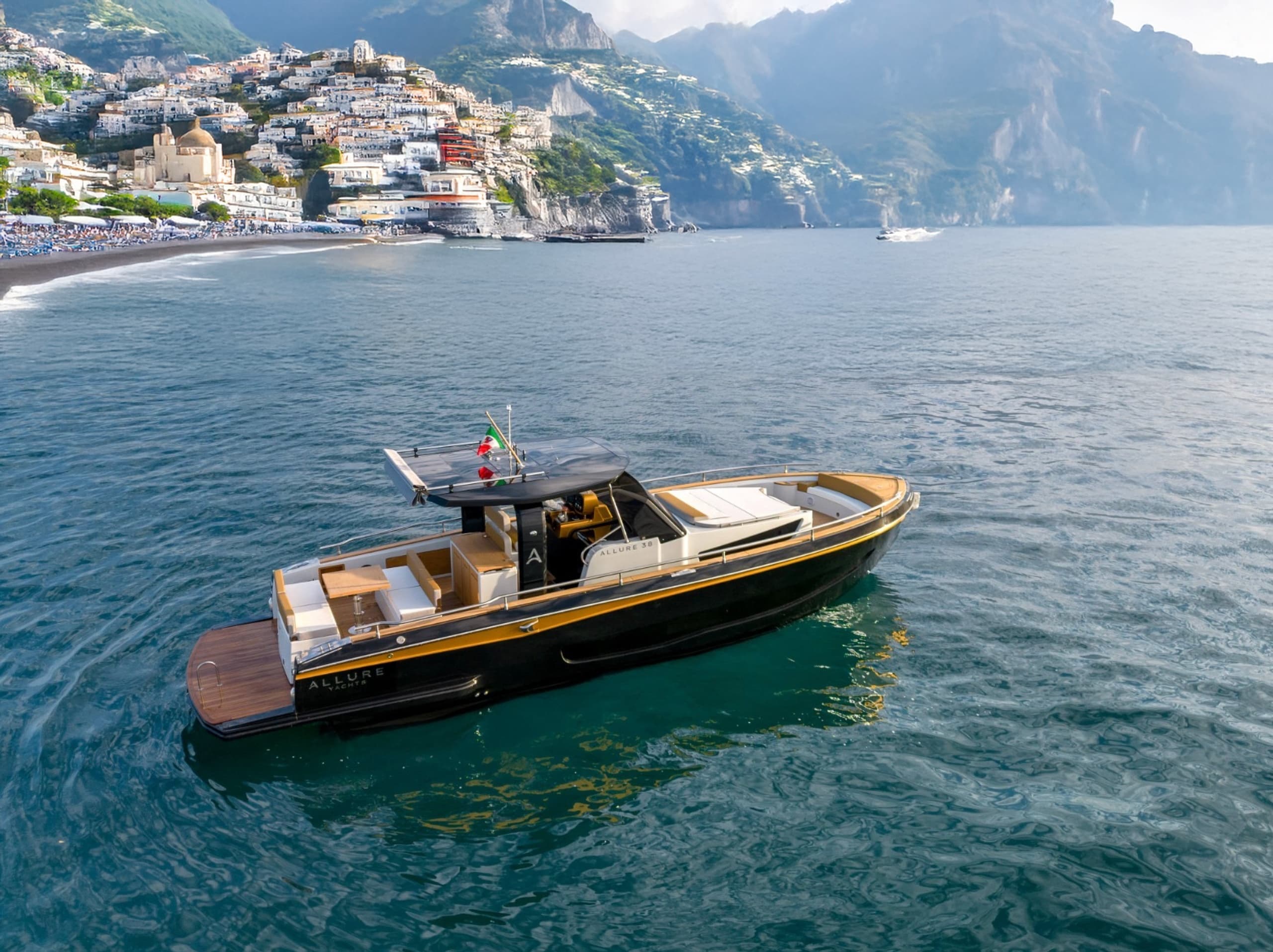 Private wooden boat cruising turquoise coastal waters near Amalfi