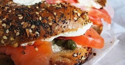 Everything bagel sandwich with smoked salmon on NYC food tour