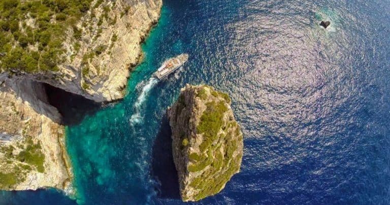 Aerial cliffs and rock islets in deep Ionian Sea, scenic view