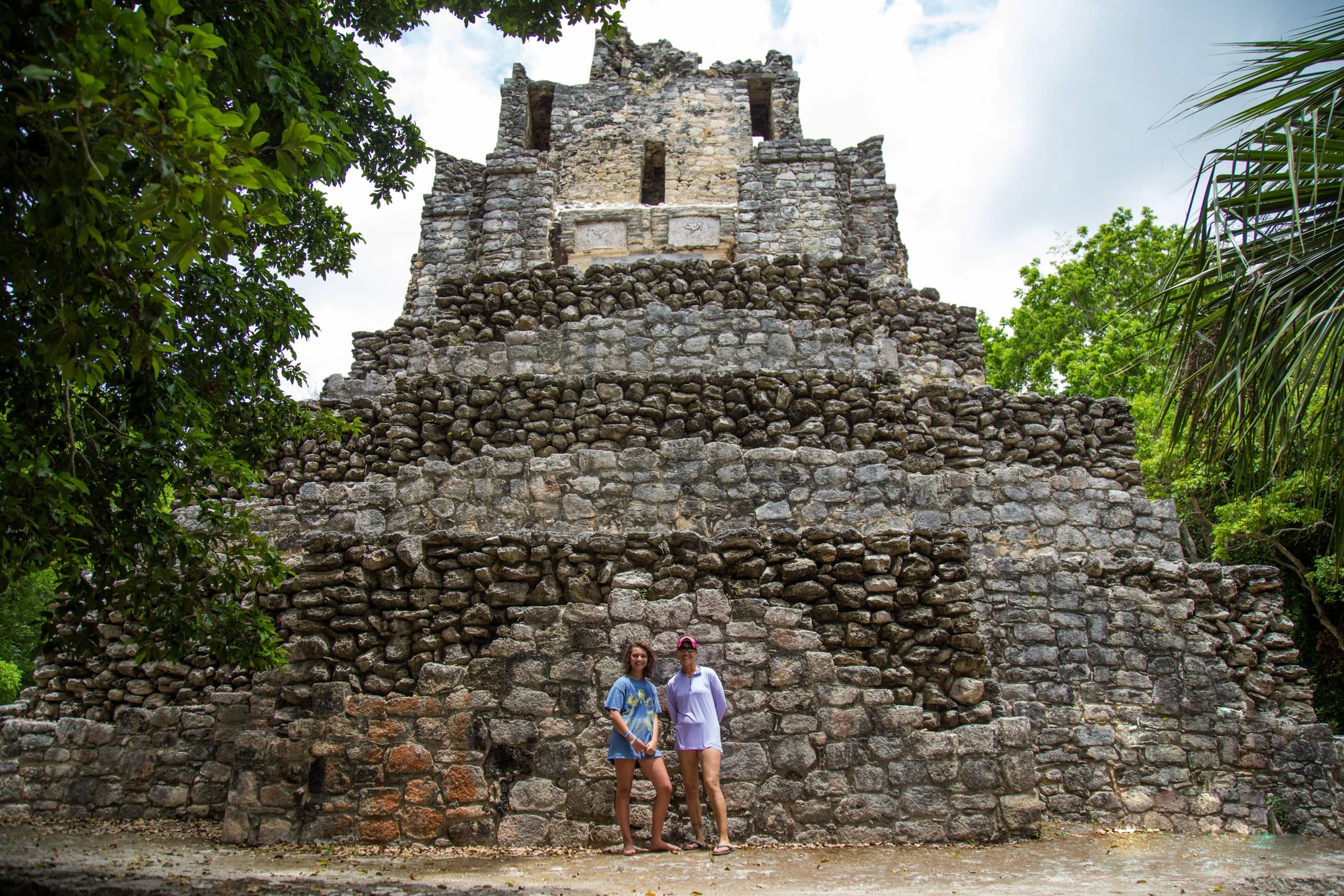 Ancient stone pyramid ruins at archaeological site, open plaza