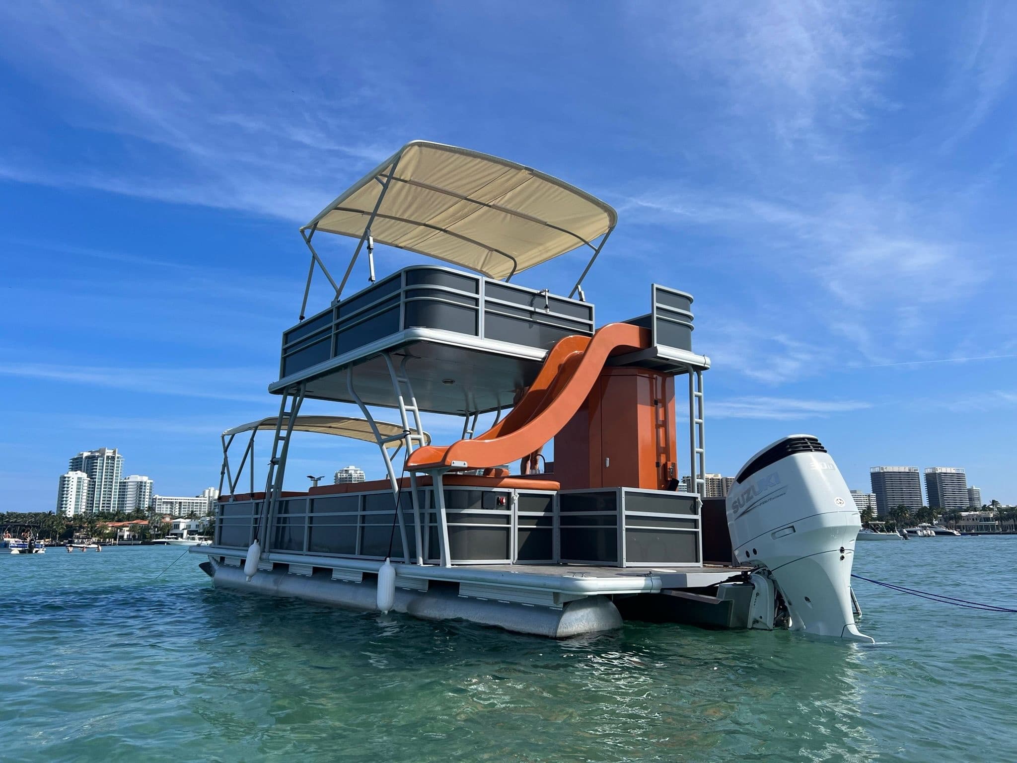 Family pontoon with water slide on Miami turquoise waters