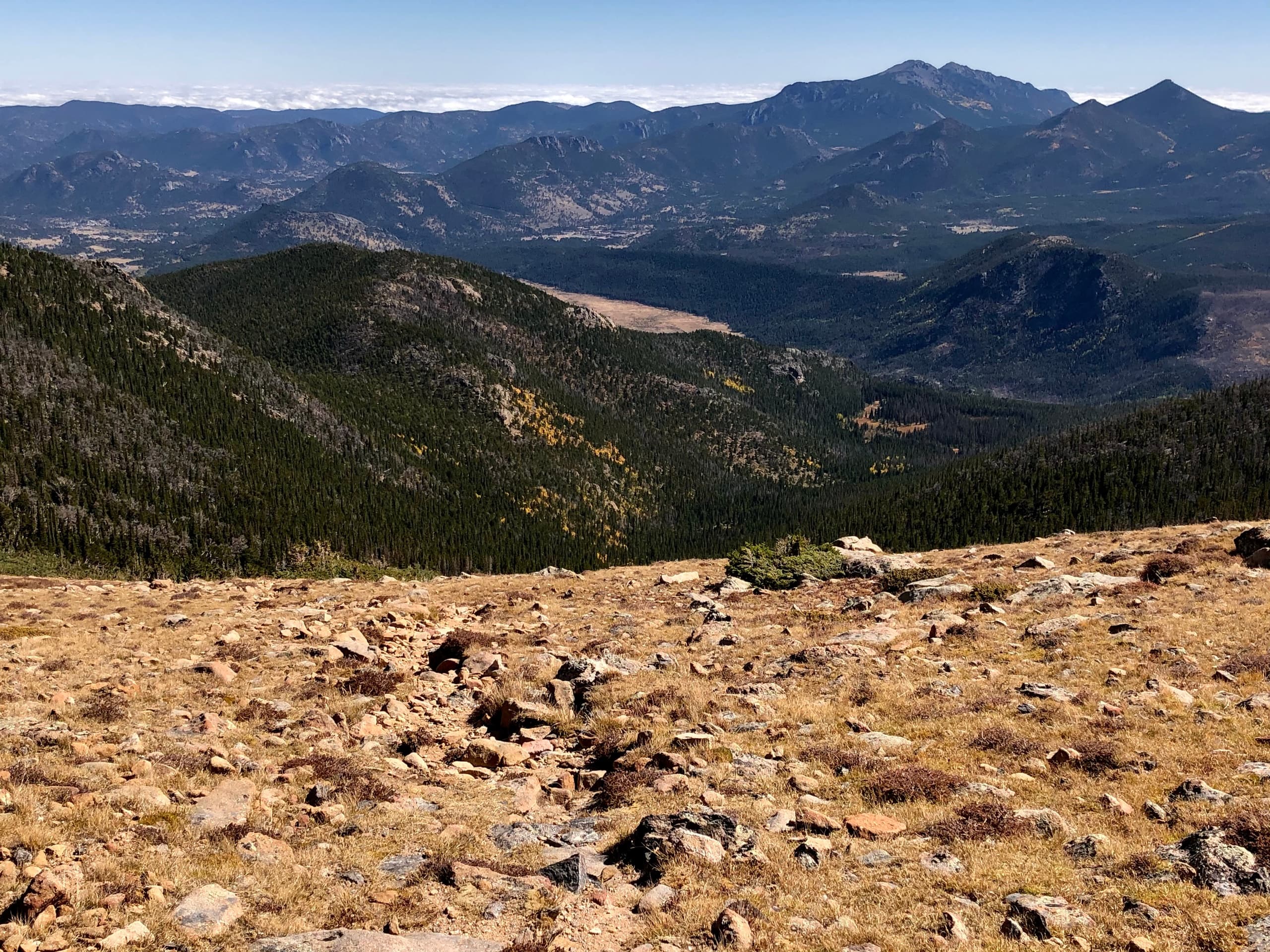 Wide panoramic mountain ridge and tundra, high-elevation hiking view