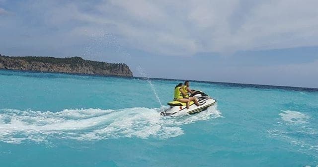 High-speed jet ski skimming turquoise Mediterranean waters