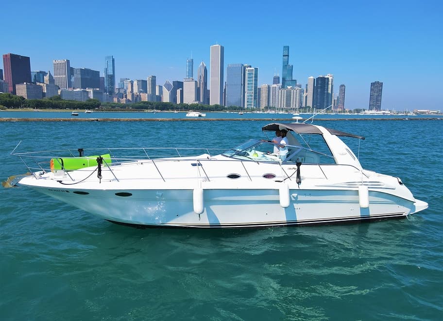 Motorboat cruising near Chicago skyline on Lake Michigan