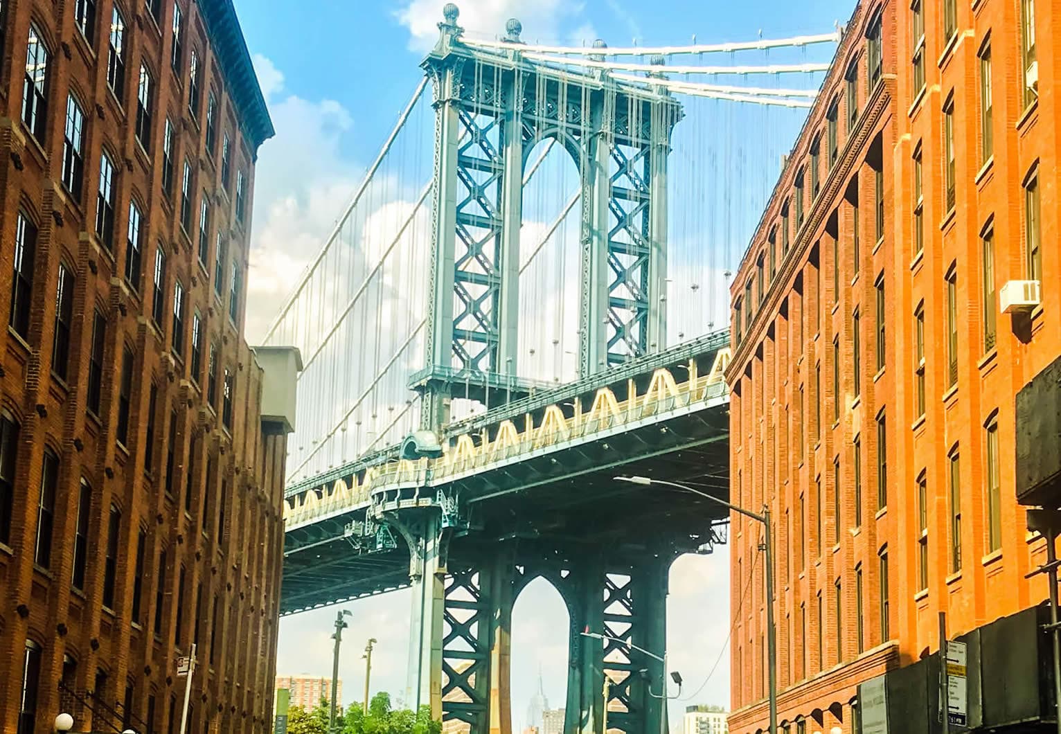 Manhattan Bridge framed by DUMBO streets, urban bridge view