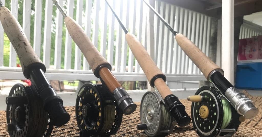 Close-up fishing rods and reels lined on dock for charter trips