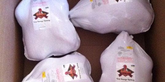 Packaged whole chickens labeled in shipping box for retail sale