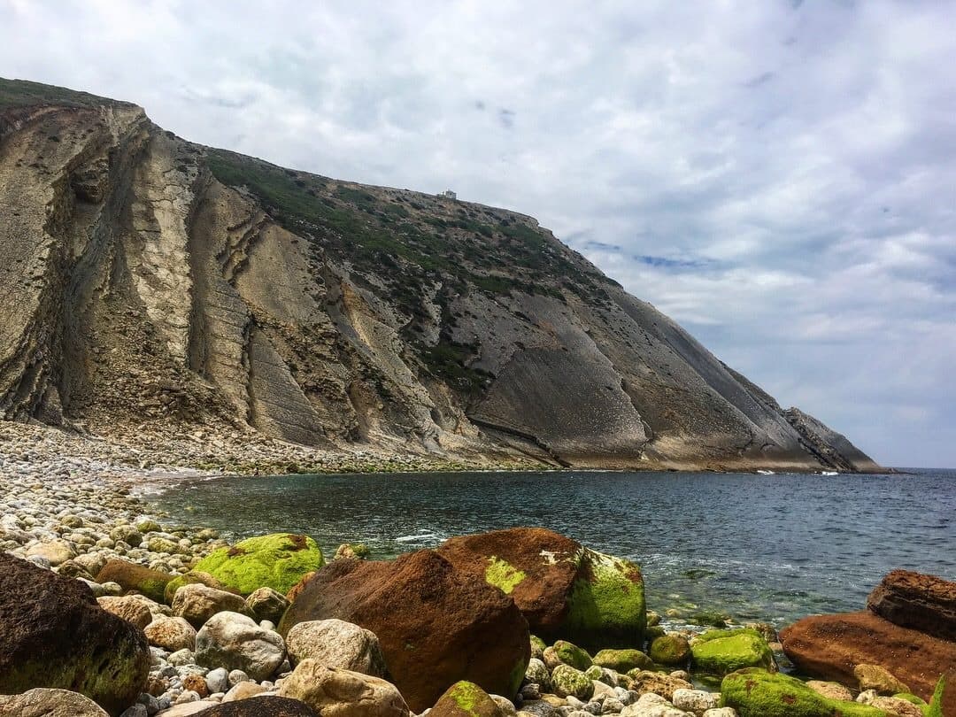 Dramatic coastal cliffs and rugged rocky shoreline, sea vista