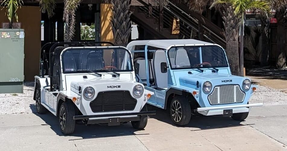 Beach Vehicle Rental with Light Blue Moke in Tropical