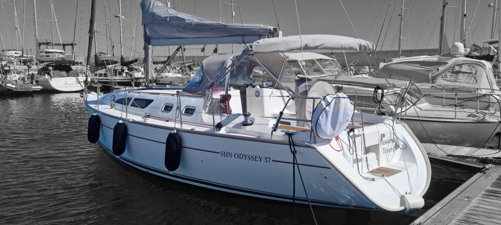Sailboat docked in Tenerife marina, panoramic harbor scene