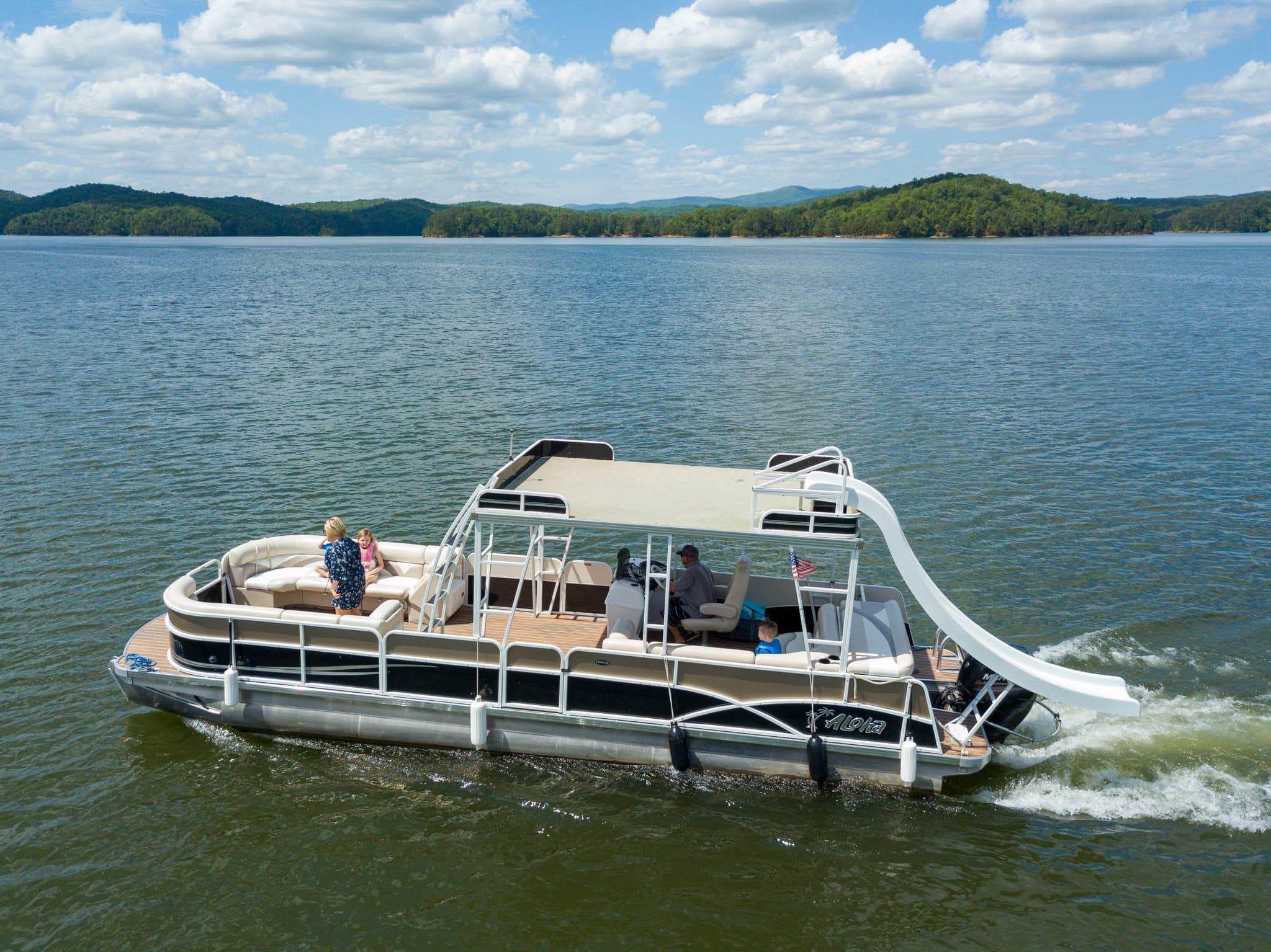 Pontoon boat with waterslide cruising scenic Carters Lake