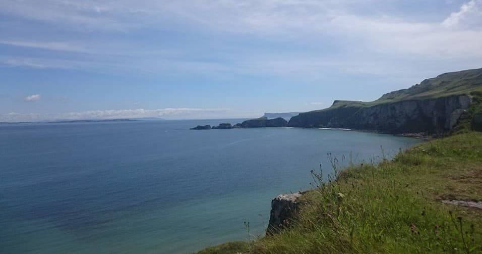 Cliffside coastal panorama along Northern Ireland shoreline view