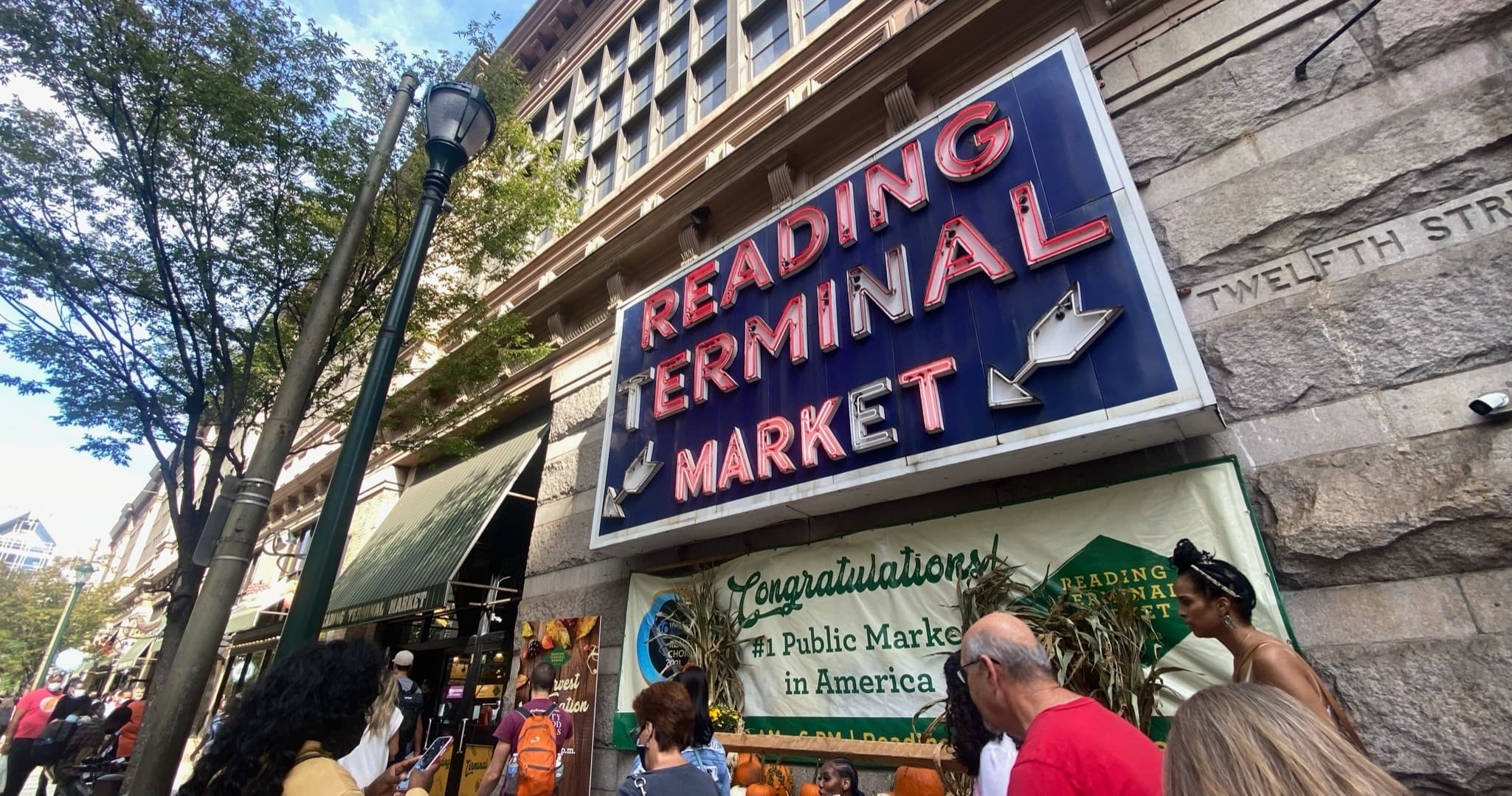 Reading Terminal Market exterior sign and busy entrance
