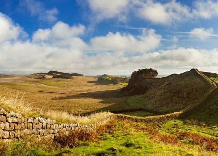 Hadrian's Wall winding across moorland, historic coastal walk