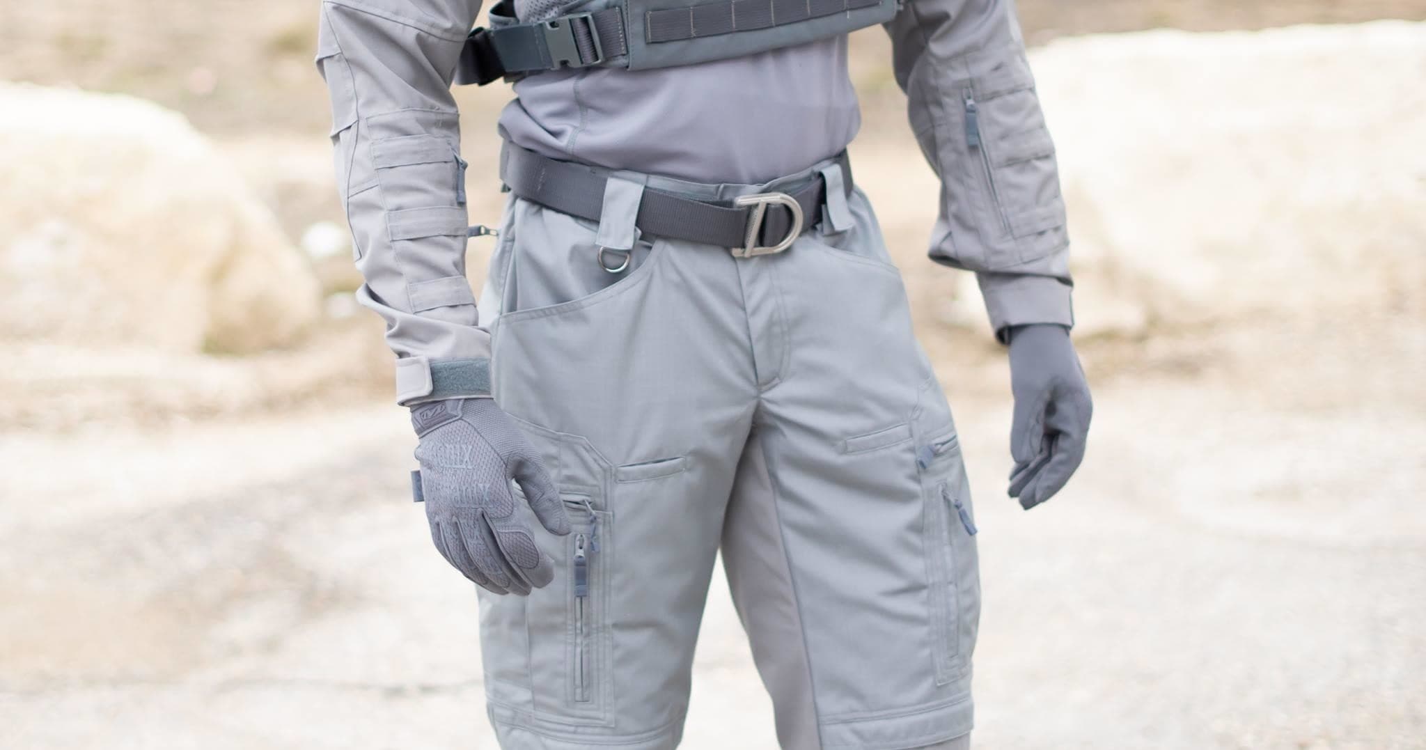 Tactical pants and gear on desert rocks, field training outfit