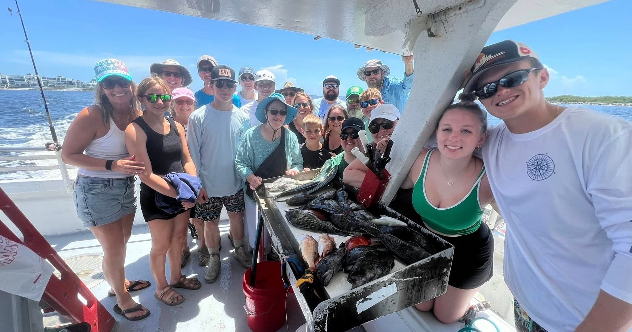 Group fishing charter on boat showing fresh catch inshore waters