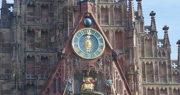 Nuremberg church clock facade and figures, historic city sightseeing