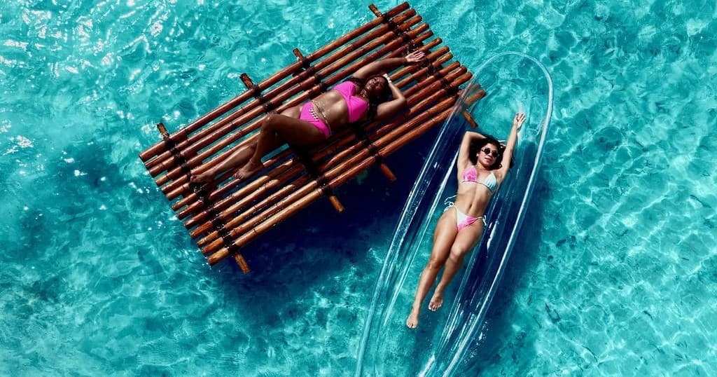Bamboo Raft Photoshoot in Aruba — Private Drone Portraits on Crystal Waters