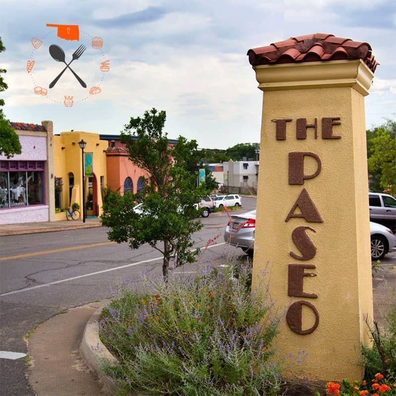 The Paseo district entrance pillar and tree-lined street scene