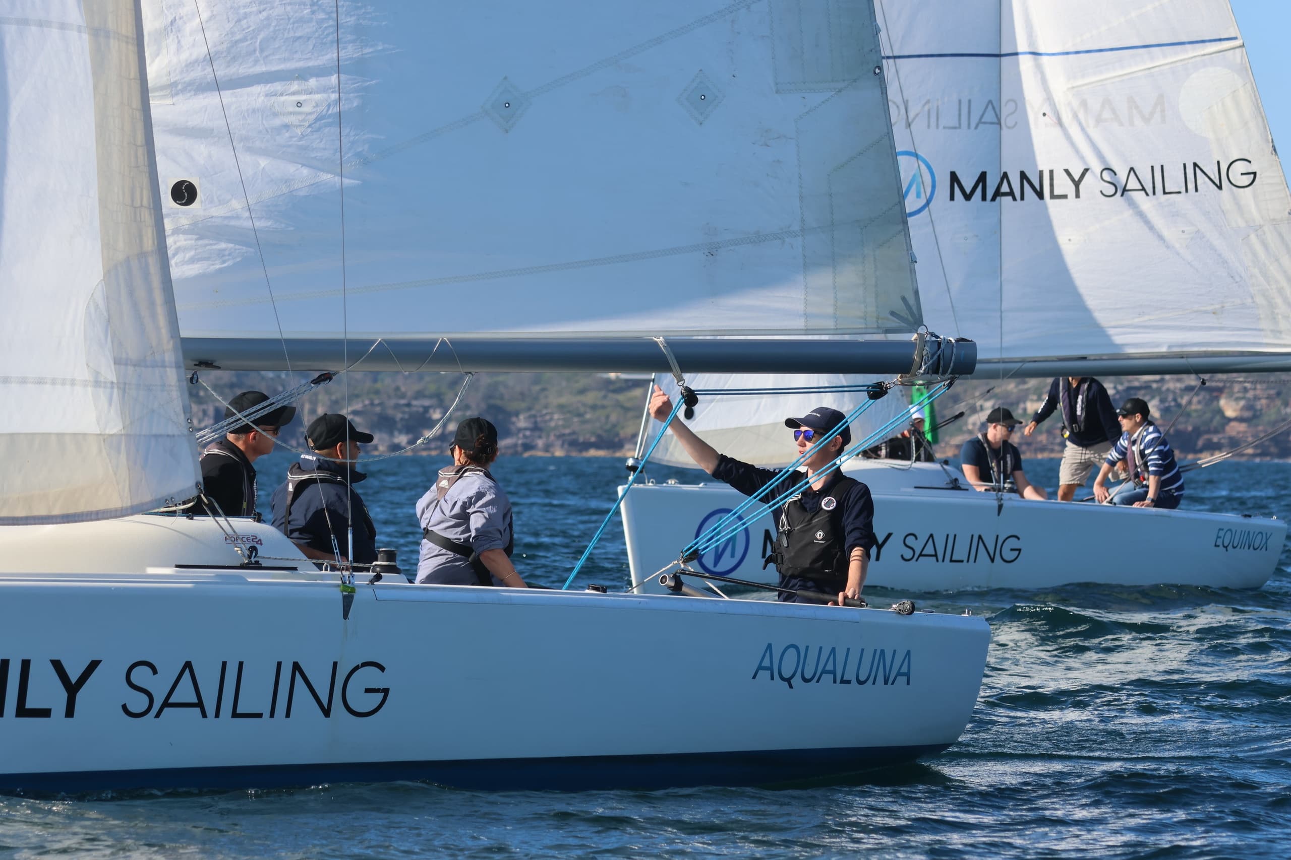 Crew working aboard Manly Sailing yacht during coastal regatta