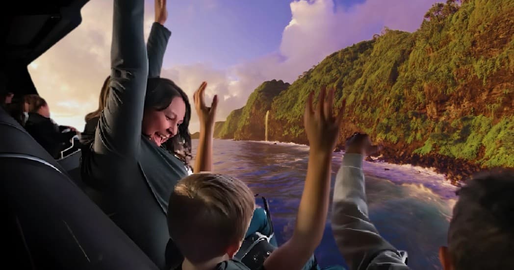Family enjoying coastal helicopter sightseeing over green cliffs