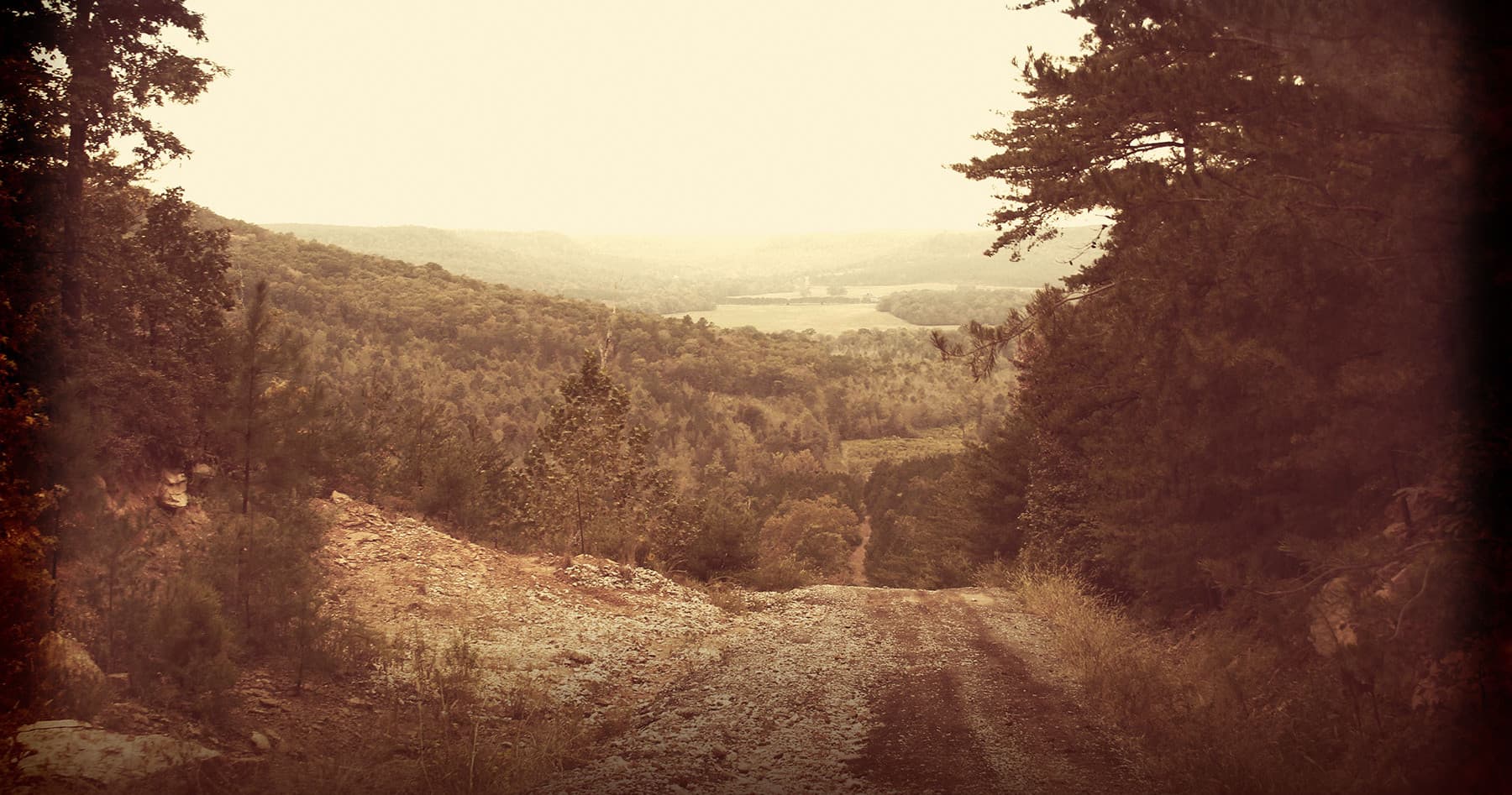 Panoramic mountain valley view showcasing off-road trails