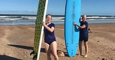Surfing Lesson with Candice LLC in [Location]