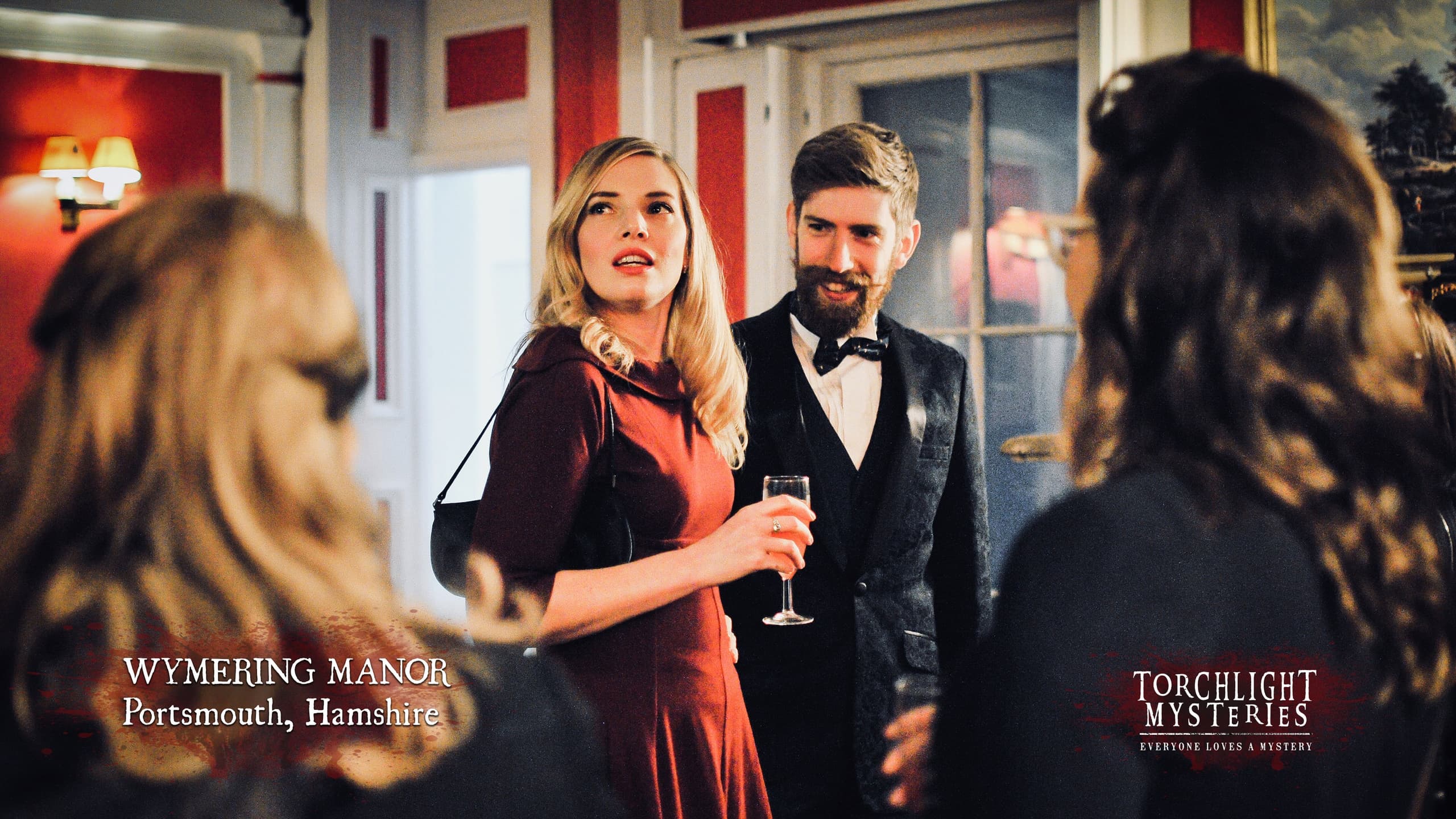 Costumed guests at manor murder mystery dinner event in Portsmouth