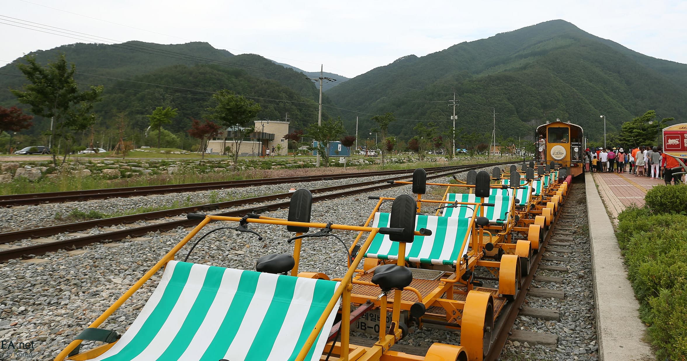 Railbikes lined on mountain railroad tracks in Adirondacks