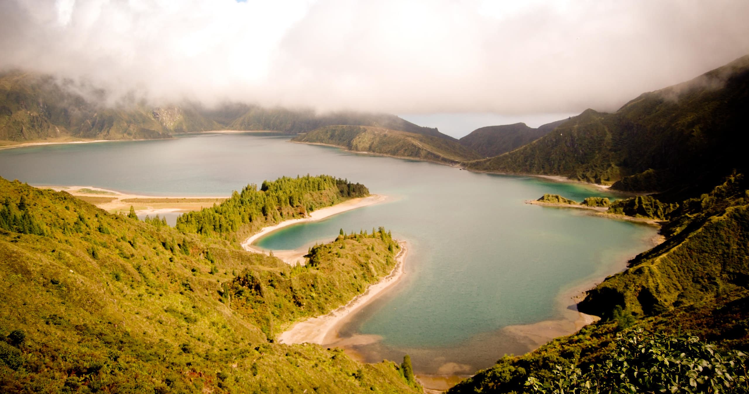 Sunlit lake valley panorama ideal for hiking tours