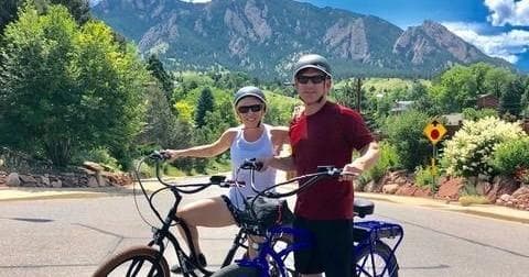 Couple on electric bikes on scenic mountain road near Boulder