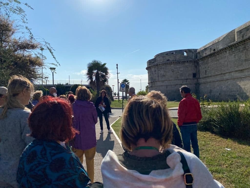 Guided seaside walking tour near historic fortress and coast