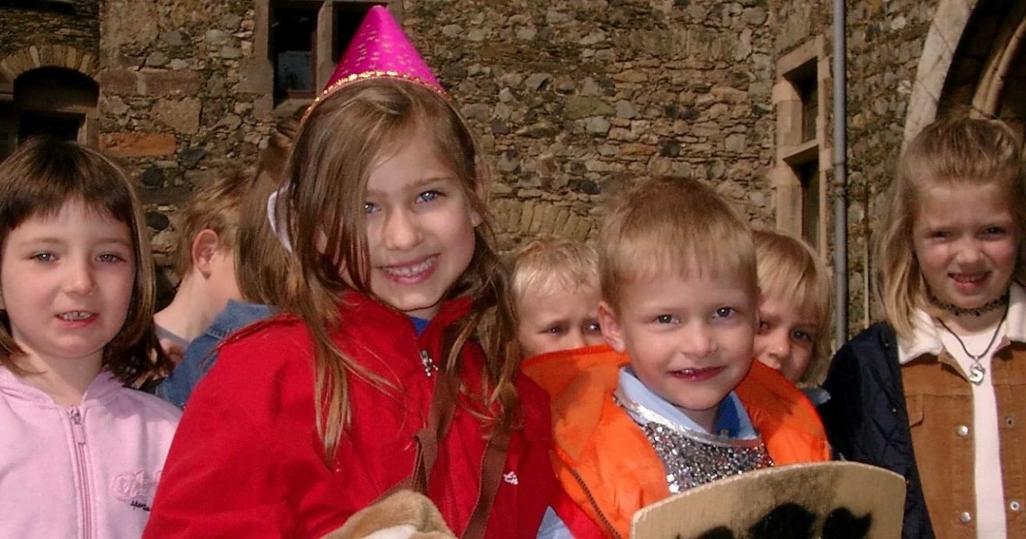Children enjoying costume party in Schloss Braunfels castle courtyard