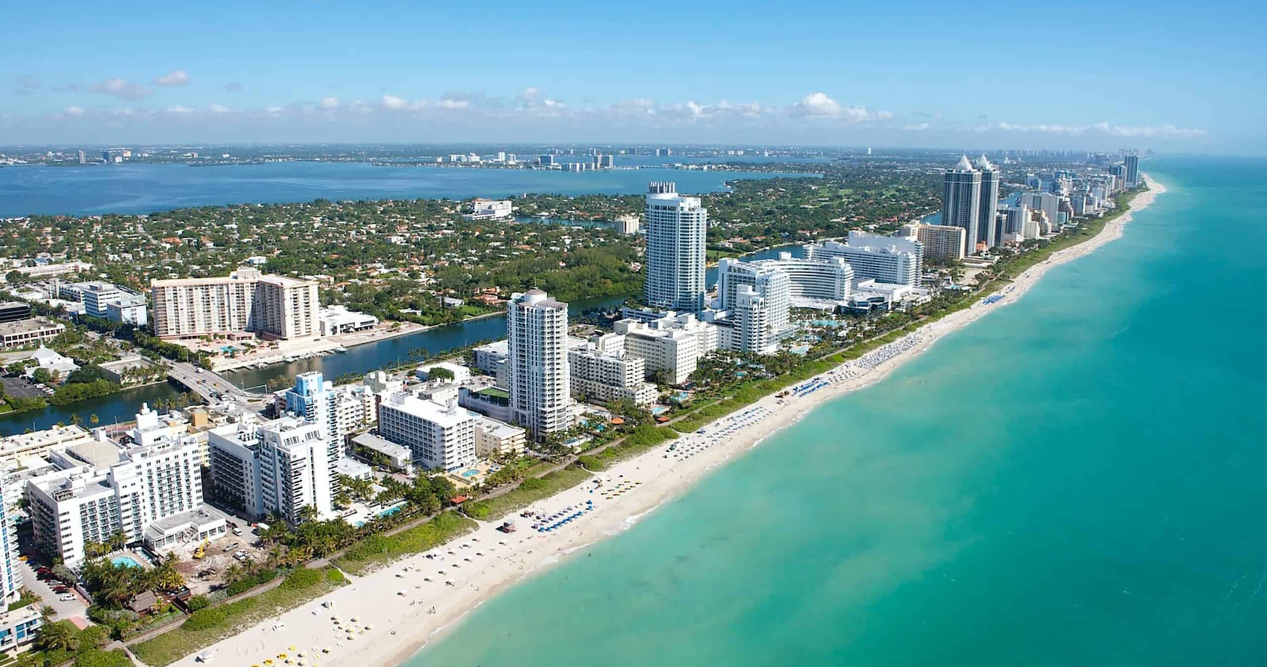Aerial coastal view of Miami Beach resorts and turquoise sea