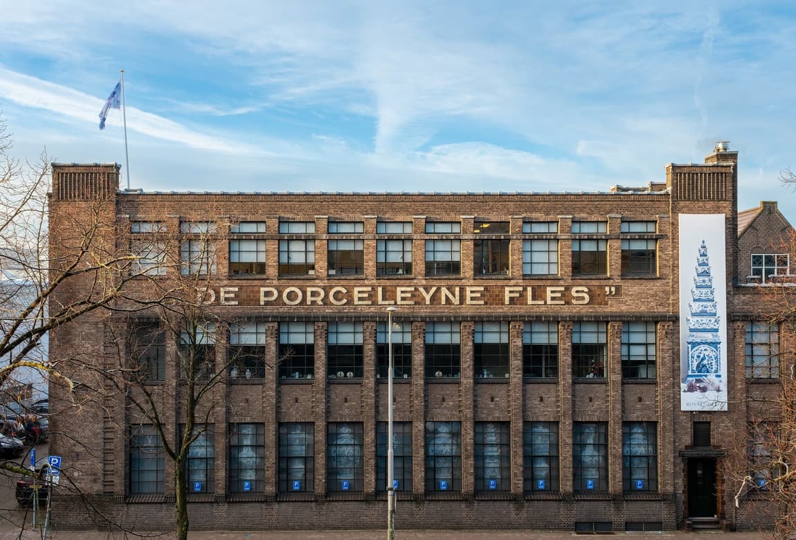 Historic porcelain factory facade on urban street museum building