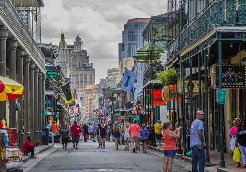 Historic French Quarter street view with walking tour crowds