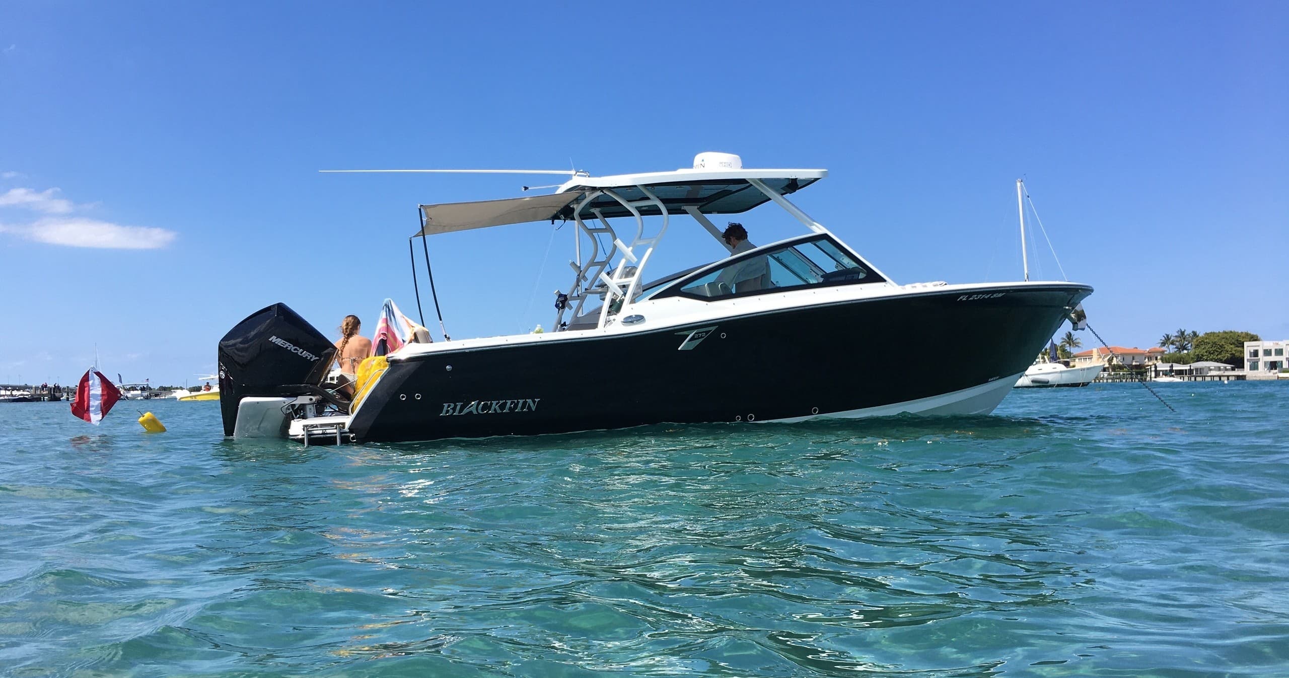Powerboat anchored in tropical coastal waters for island charters