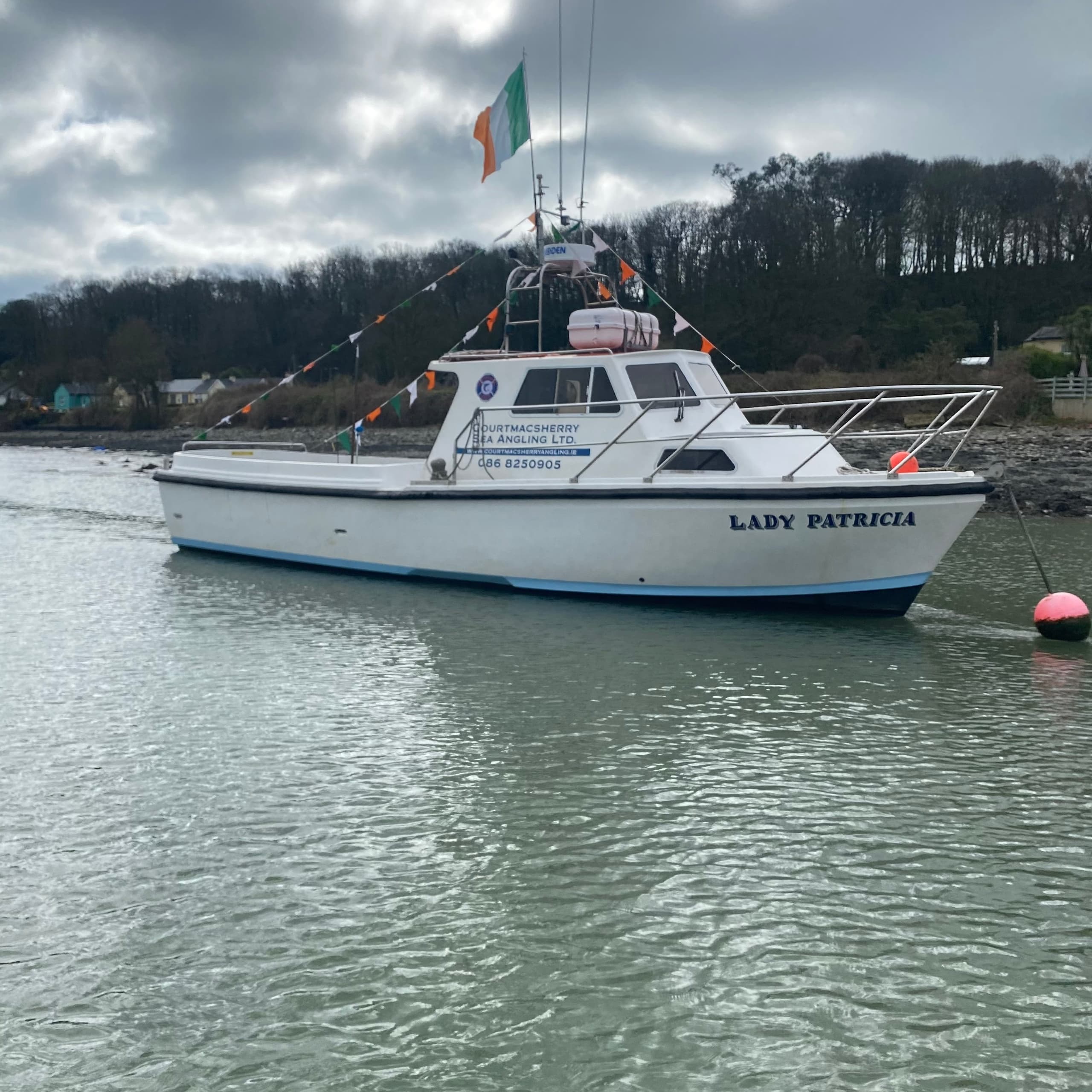 Fishing and wildlife charter boat Lady Patricia moored in harbor