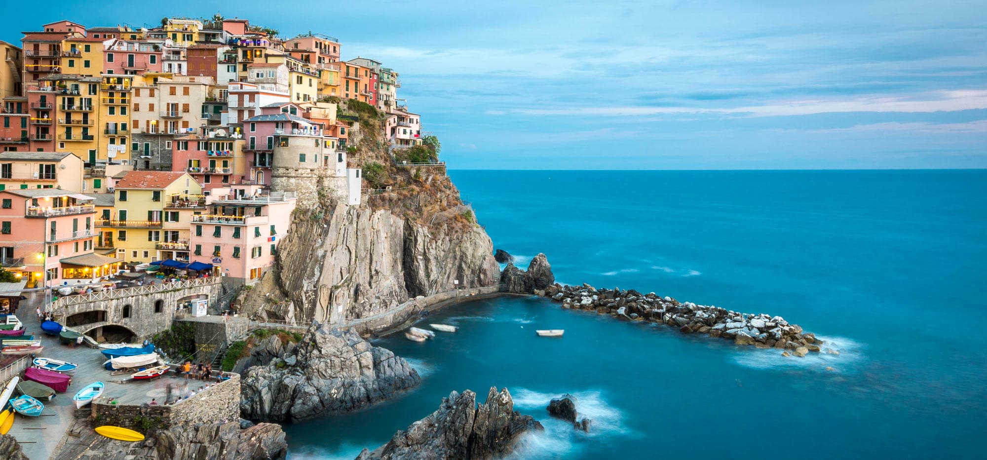 Colorful coastal village perched on cliffs with ocean view