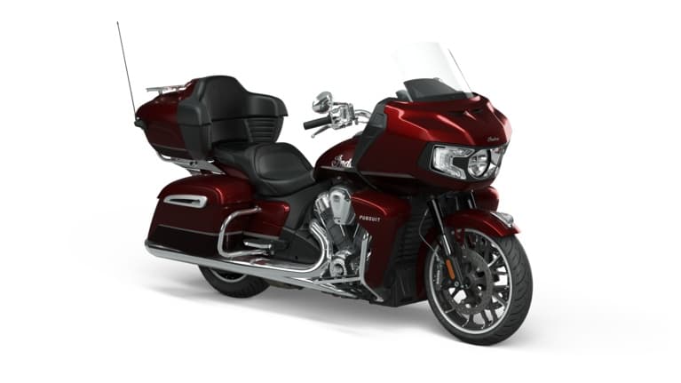 Red luxury touring motorcycle with trunk on white studio