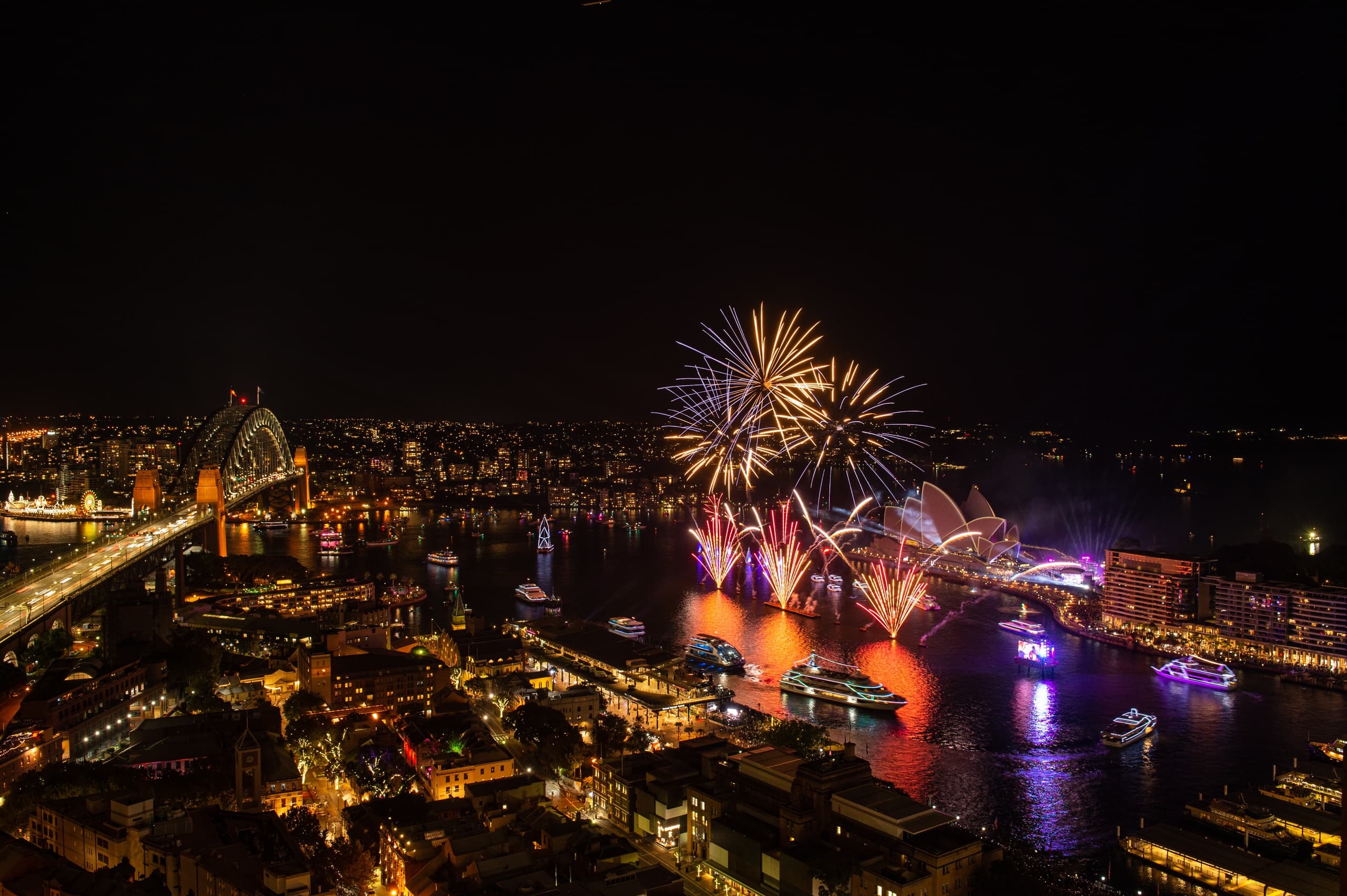 Nighttime fireworks over Sydney skyline and harbour bridge view