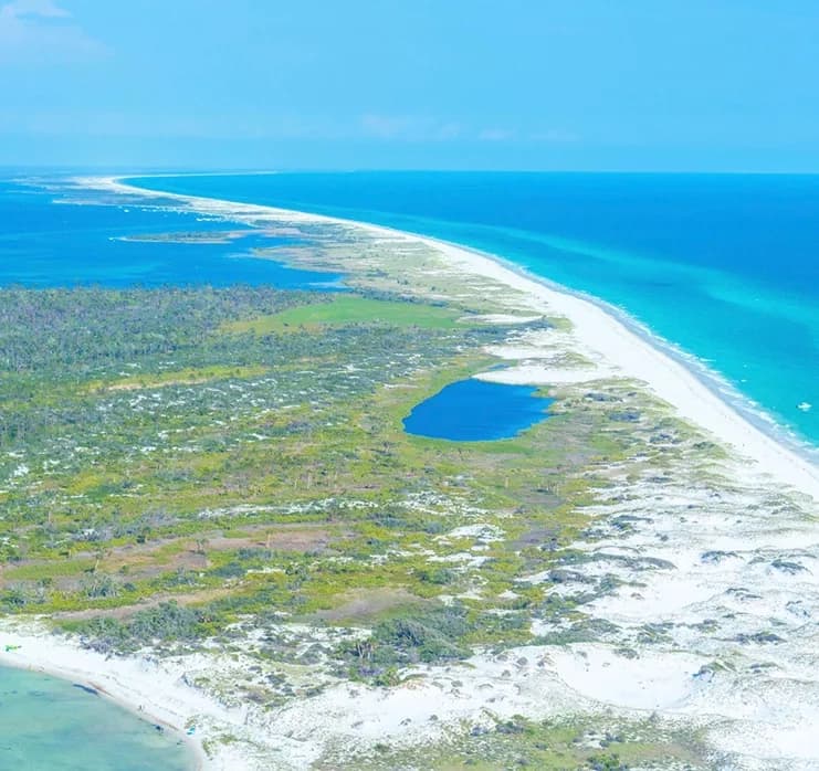 Aerial panoramic of barrier island and turquoise Panhandle waters