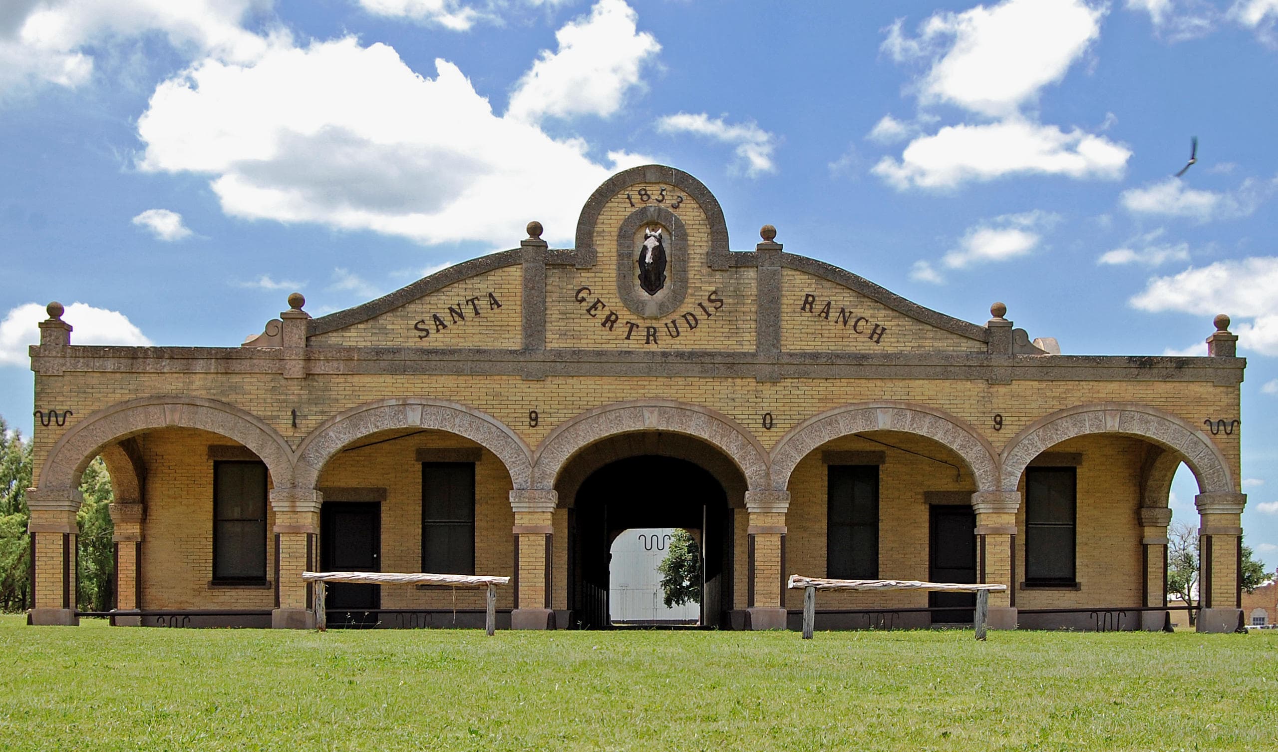 Historic King Ranch ranch house facade under blue Texas sky